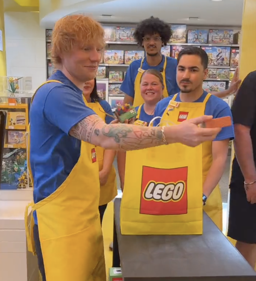 Ed Sheeran handing out minifigures