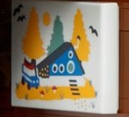 LEGO Ideas 21338 A Frame Cabin artwork above bed